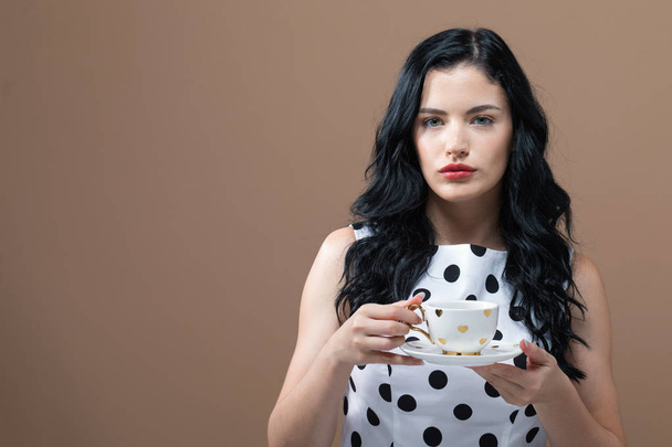 Young woman drinking coffee - Foto, Imagem