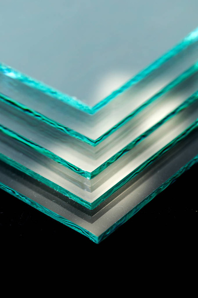 Sheets of Factory manufacturing tempered clear float glass panels cut to size - Photo, Image