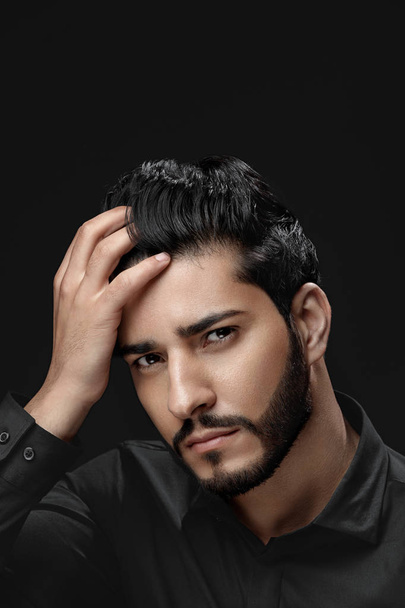 Men Hair Care. Man With Beard, Beauty Face Touching Black Hair - Photo, Image