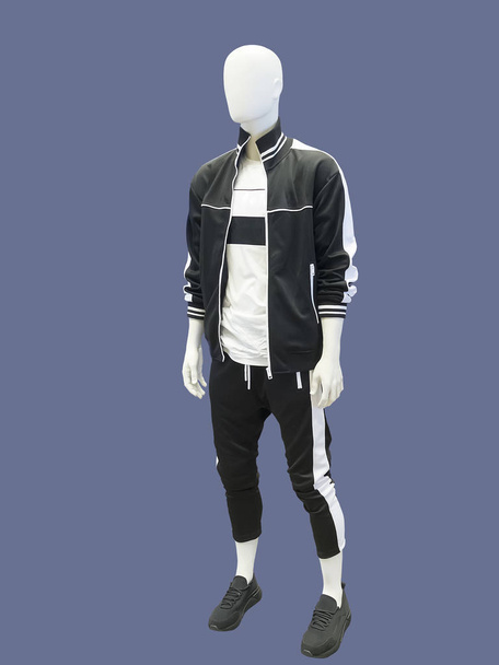 Full-length man mannequin, wearing clothes for sport, isolated No brand names or copyright objects. - Photo, Image