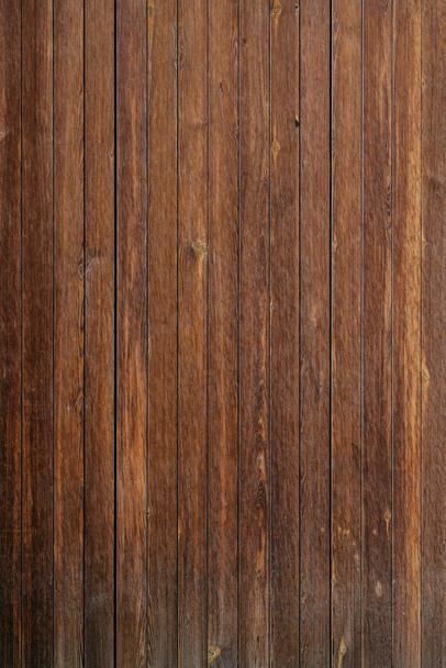 Vertical grungy ancient wooden planks in Spain. Wooden dark brown texture - Photo, Image