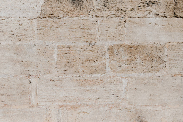 Beige grungy antiikin tiili kivimuuri Espanjassa
 - Valokuva, kuva