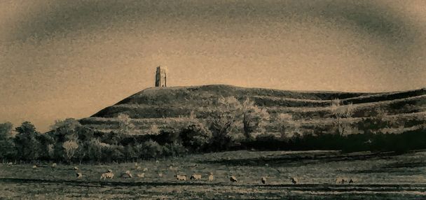 Овець мирно пастися в лузі в тіні містичних стародавніх вежі на Ґластонбері Tor Somerste Англії - Фото, зображення