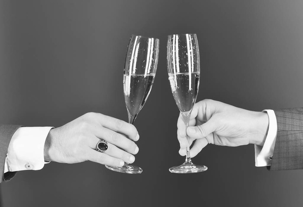 Corporate Christmas party concept. Businessmen raising toast with champagne - Foto, immagini