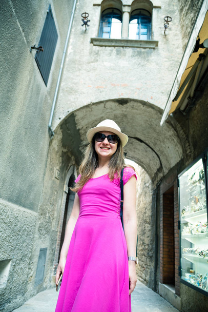 A beautiful touristic girl visiting the city of San Marino, travel and vacation - Φωτογραφία, εικόνα