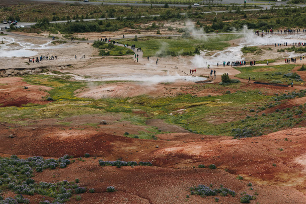 ICELAND - 20 JUNE 2018: aerial view of tourists near volcanic vents in Haukadalur valley - Valokuva, kuva
