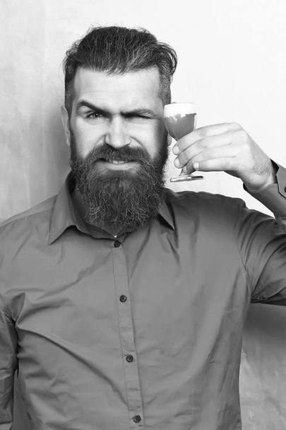 Brutal caucasian hipster holding alcoholic shot - Fotó, kép