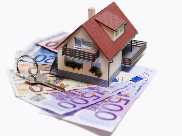 House with Euro banknotes and house key - Fotó, kép