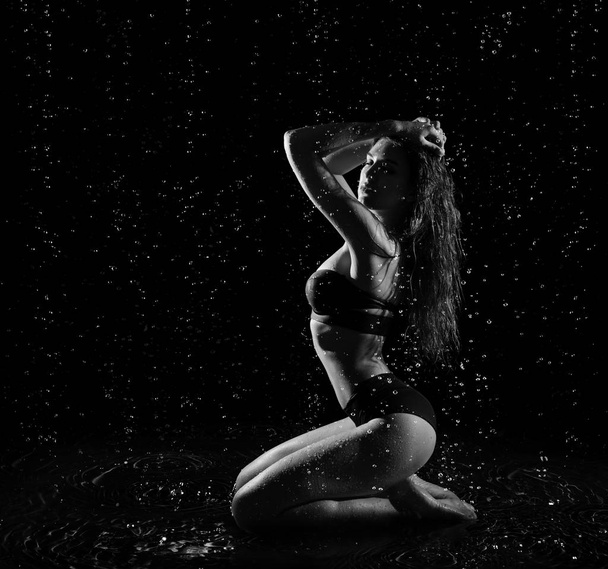 Young woman with water drops (monochrome ver) - Foto, imagen