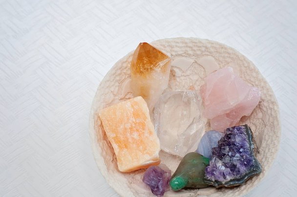 Healing crystals or gemstones: Amethyst Point and cluster, Green aventurine, agate, clear quartz, Citrine, calcite and rose quartz are used to bring positive energy and also inner peace - Photo, Image