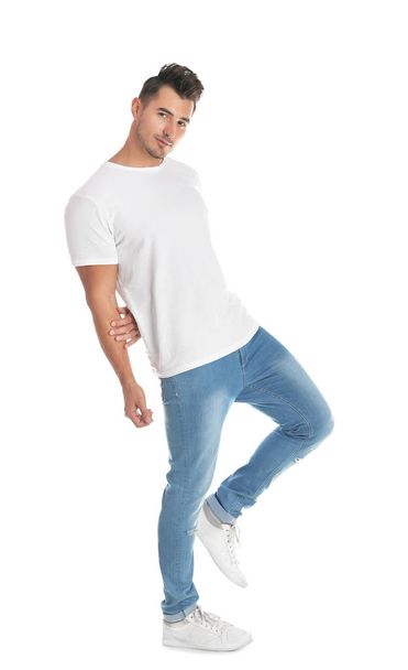 Young man in stylish jeans on white background - Photo, Image