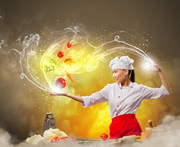 Asian female cooking with magic - Фото, зображення