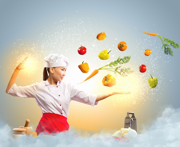 Asian female cooking with magic - Фото, зображення