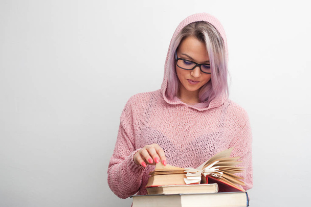 Student. Young woman with books. Girl a student makes research - Foto, Imagem