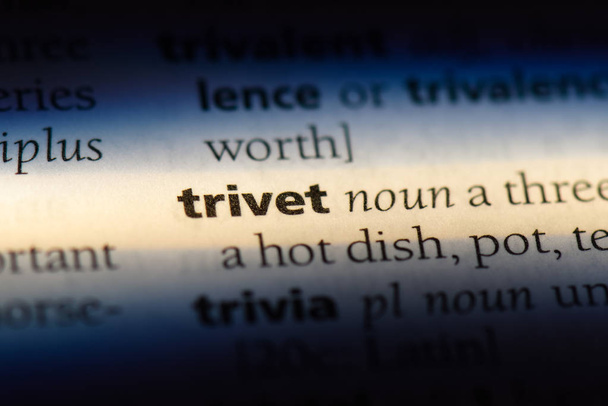 trivet word in a dictionary. trivet concept. - Photo, Image