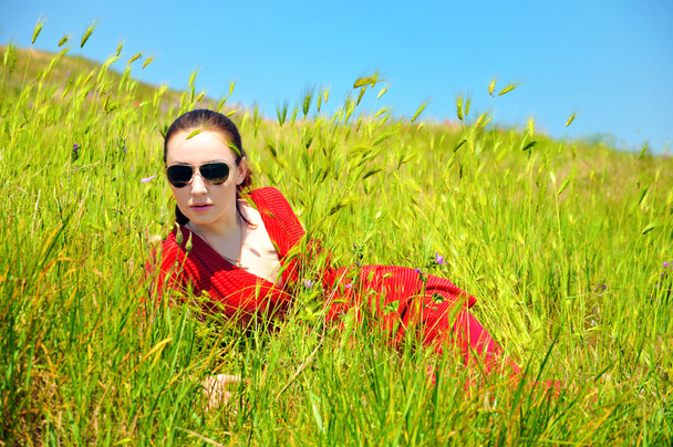 Girl in grass - Фото, изображение