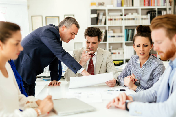 Business people having a board meeting - Фото, изображение