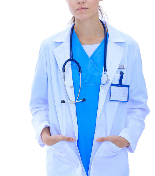 Beautiful young woman in white coat posing with hand in pocket. Woman doctor - Фото, зображення