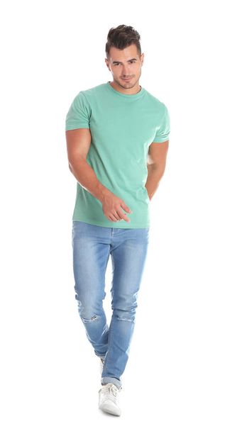 Young man in stylish jeans on white background - Fotó, kép