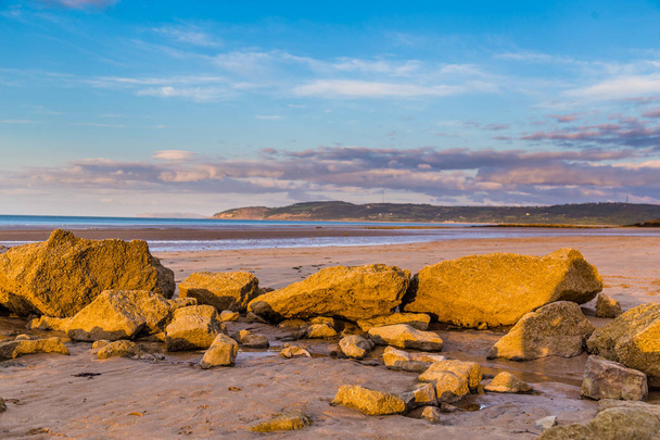 Auringonlasku rannalla, Wales, Yhdistynyt kuningaskunta
 - Valokuva, kuva