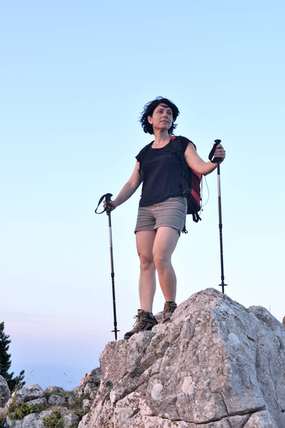 portrait of a female hiker who has reached the top - Photo, Image