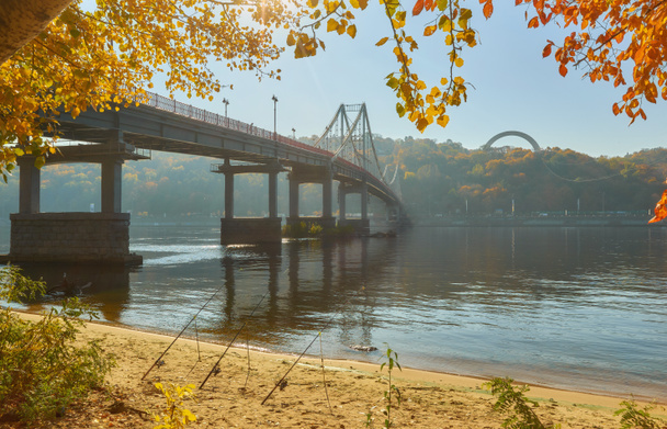 Pedestrian bridge across the Dnieper River, autumn landscape, Kiev, Ukraine - Photo, Image