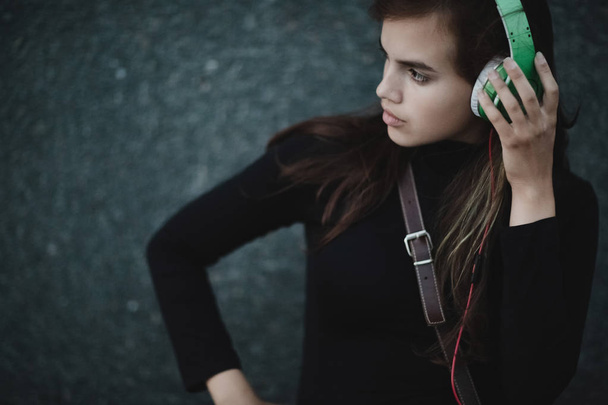 Web radios music concept. Young pretty girl with headphones. - Fotografie, Obrázek