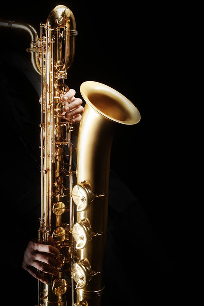Saxophone player Saxophonist playing jazz music instrument. Baritone sax player - Valokuva, kuva