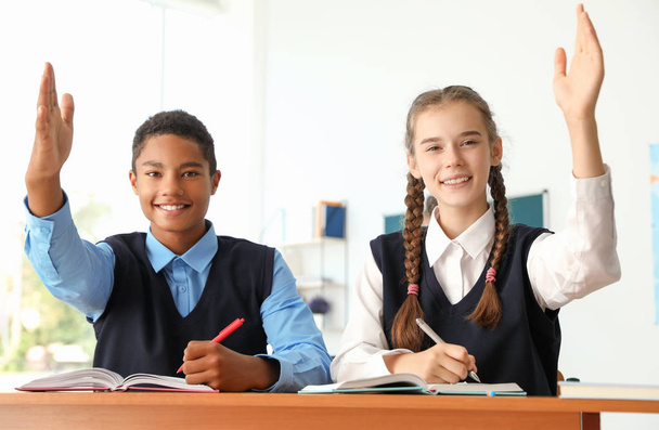 Teenage students in classroom. Stylish school uniform - Valokuva, kuva