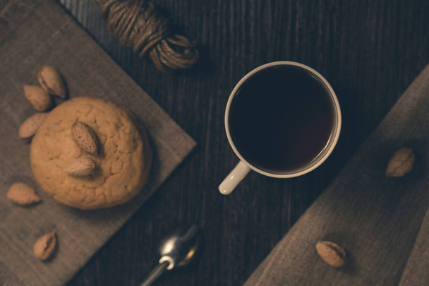 A cup of black tea with cookies. - Foto, imagen