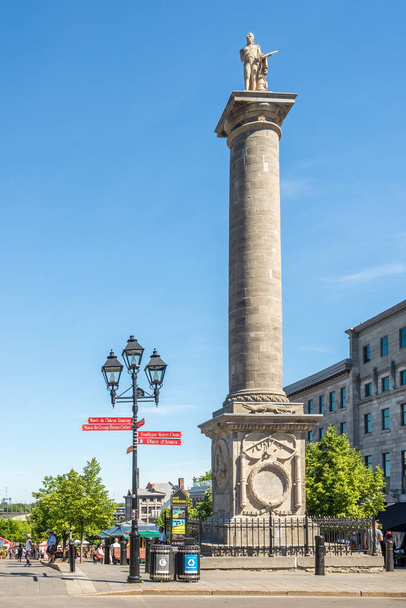 MONTREAL, CANADA - JUNE 22,2018 - View at the Nelson Column in the streets of Montreal. Some of the citys earliest still-standing buildings date back to the late 17th and early 18th centuries. - Fotografie, Obrázek