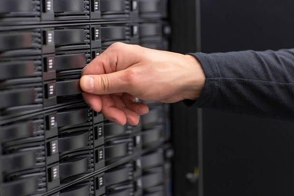 Close-up of IT Consultant Maintain SAN and Servers in Datacenter - Fotó, kép