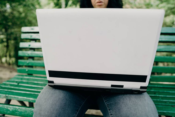 obese female worker with laptop working outdoors - Foto, Bild