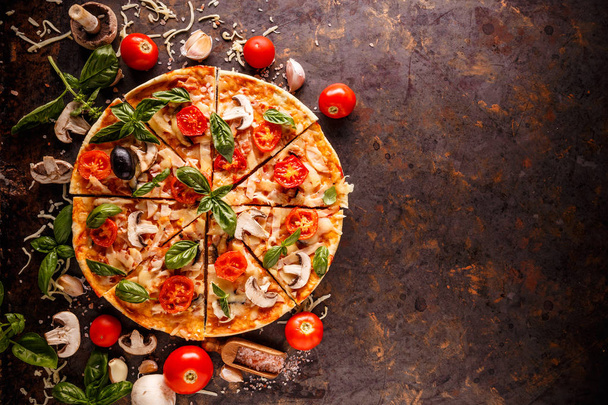 Composition with pizza, cherry tomatoes, mushroom and fresh basil, space for your text - Valokuva, kuva