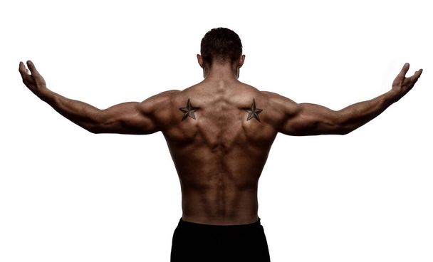 Rear view, silhouette of healthy young sports man with his arms stretched out, isolated on white background  - Photo, image