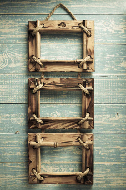 photo picture frame on wooden background - Foto, afbeelding