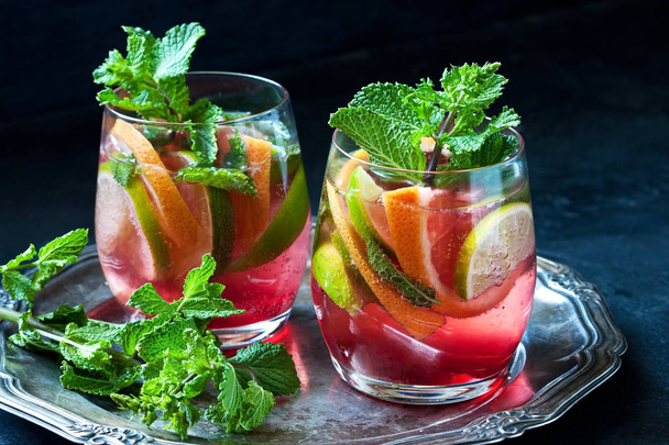 Summer   citrus cold drink (juice,  lemonade, cocktail) with  mint , selective focus - Photo, image