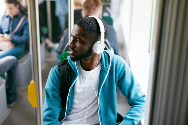 Man In Headphones Listening Music Riding In Transport - Фото, изображение