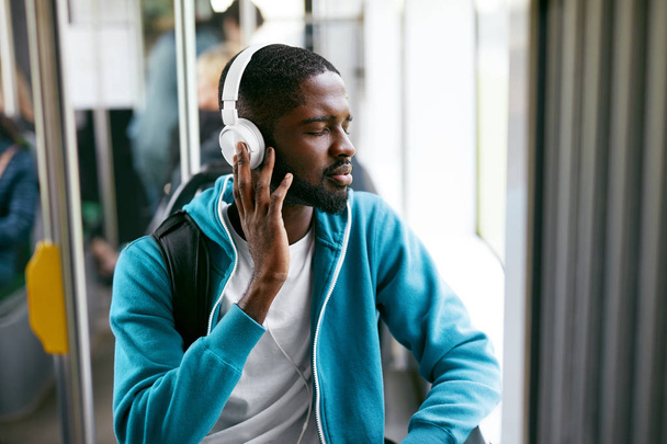 Man In Headphones Listening Music Riding In Transport - Fotografie, Obrázek