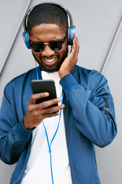 Music. Man With Phone Listening Music In Headphones - Valokuva, kuva