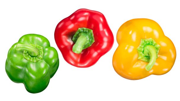 Red, Green and Yellow Bell Peppers (Capsicum annuum), whole pods, top view - Photo, Image