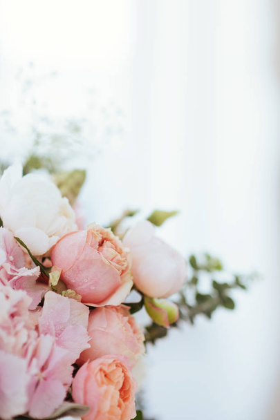 Beautiful blossoming flowers: peonies, roses, ranunculus, tulips, carnations,eustoma lisianthks hydrangea in tender pink colour - Fotó, kép