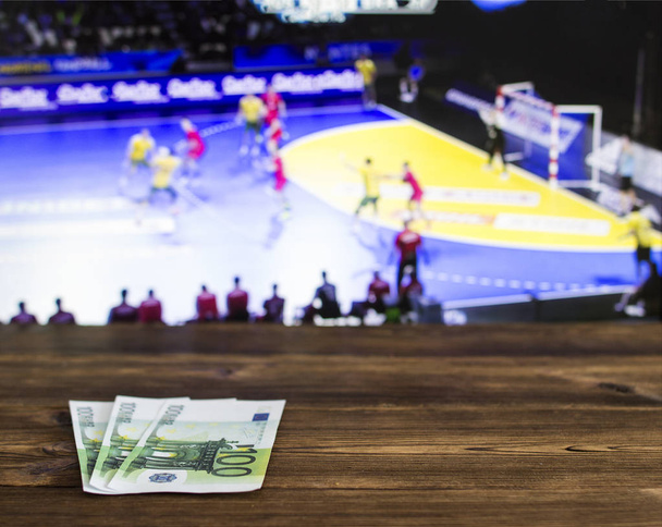 Euro money on the background of the TV on which show volleyball, sports betting, bookmaker, euro - Fotografie, Obrázek
