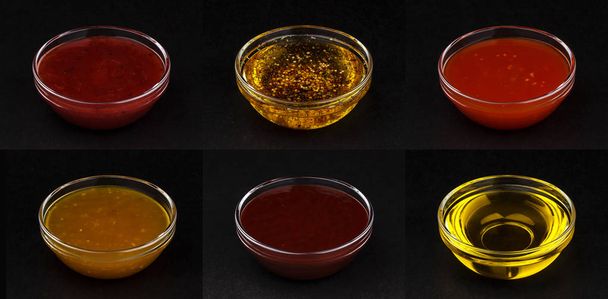 Different sauces isolated on black background - Photo, Image
