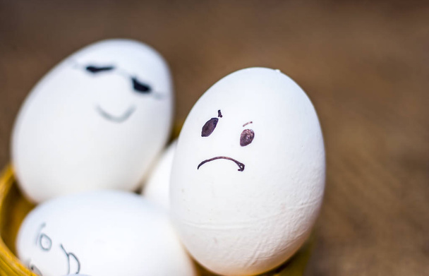 Close up view of eggs with drawn funny faces on them. - Fotoğraf, Görsel