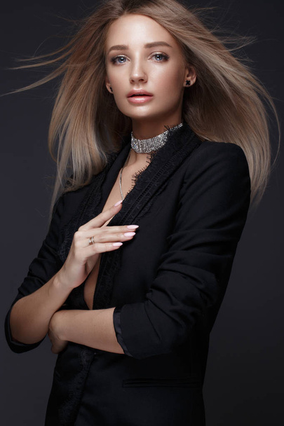 Beautiful woman with evening make-up and long straight hair . Smoky eyes. Fashion photo. - Fotó, kép