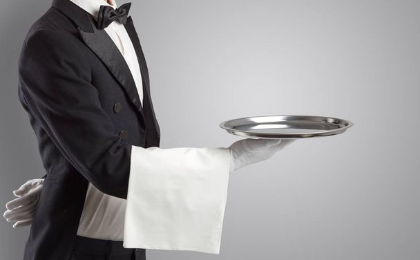 Waiter serving with white gloves and steel tray - Fotografie, Obrázek