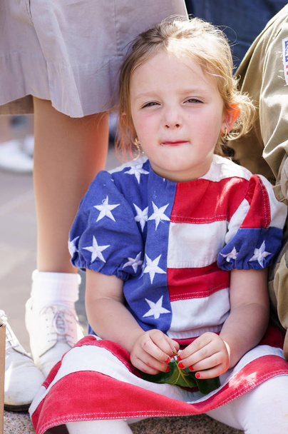 SAINTE-MERE-EGLISE, FRANCE - JUNE 6, 2014: Girl with a dress of american flag pattern during the commemoration of the 70th anniversary of D-Day - Photo, Image