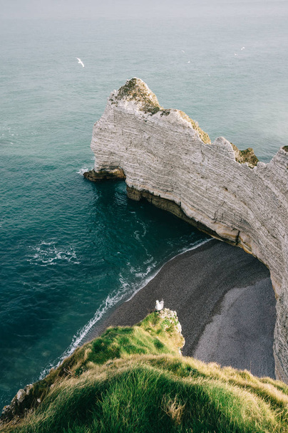 Etretat cliff, rocks and natural arch landmark and blue ocean.Normandy, France, Europe - 写真・画像