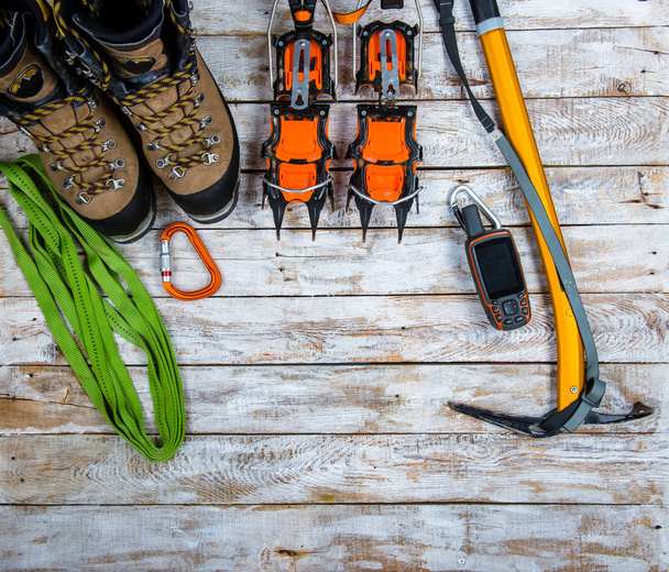 climbing equipment on a wooden background - Foto, imagen